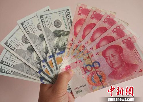 資料圖：人民幣和美元,。<a target='_blank' href='http://www.chinanews.com/' >中新網(wǎng)</a>記者 李金磊 攝