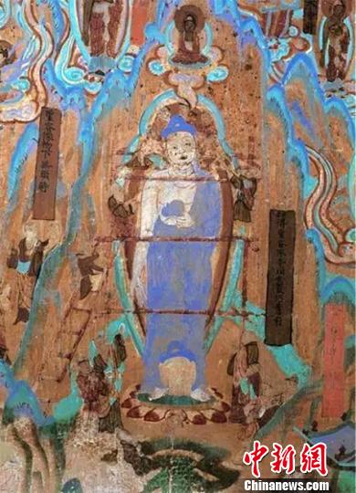 圖為莫高窟72窟壁畫(huà)工匠安裝佛頭(五代),。敦煌研究院供圖 攝