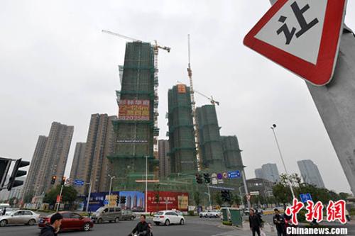 資料圖：一處商品房在建中,。 <a target='_blank' href='http://www.chinanews.com/'>中新社</a>記者 呂明 攝