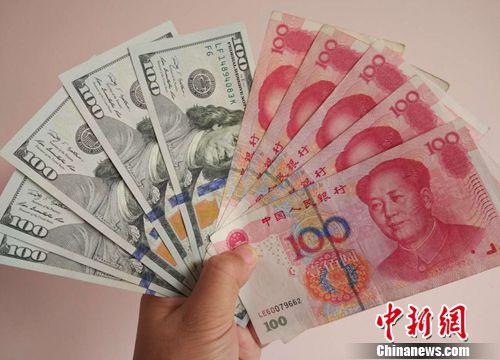 資料圖：人民幣和美元,。<a target='_blank' href='http://www.chinanews.com/' >中新網(wǎng)</a>記者 李金磊 攝