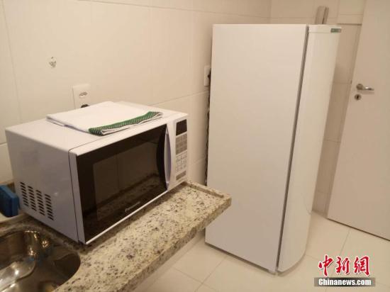 廚房里有簡(jiǎn)單的家用電器,。 <a target='_blank' href='http://www.chinanews.com/'>中新社</a>記者 盧巖 攝