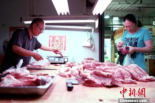 資料圖：民眾購買豬肉,。<a target='_blank' href='http://www.chinanews.com/'>中新社</a>記者 張遠(yuǎn) 攝