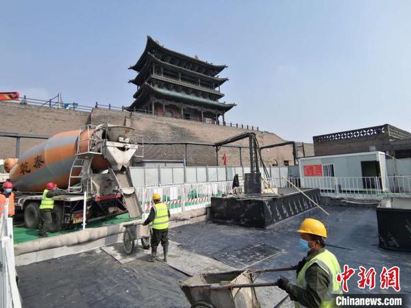 平遙古城“疫后”搶時間重塑“地下經(jīng)絡”,?！±钚骆i 攝